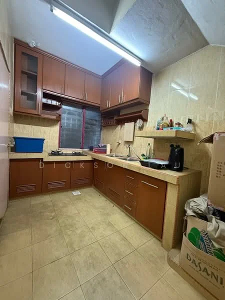 Kitchen features: brown wooden cabinetry, granite countertop, single-bowl stainless-steel sink, chrome pull-down faucet, built-in oven, freestanding range oven, ceramic tile flooring, wall-mounted window, recessed ceiling lights, kitchen appliances, blue plastic storage container, cardboard boxes.