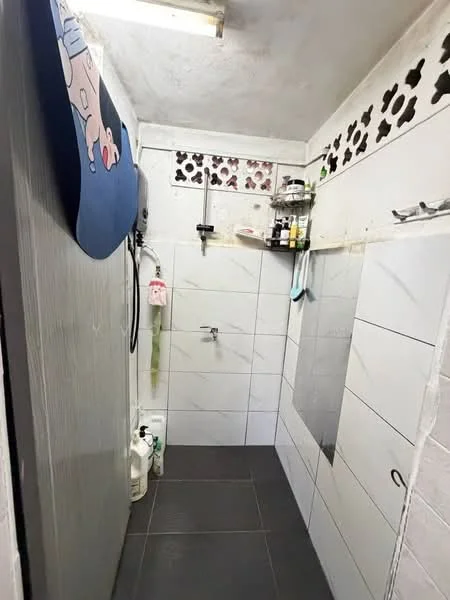 Bathroom features: white tiled walls, grey ceramic tile flooring, glass shower enclosure, wall-mounted shower head, chrome faucet, shelf with toiletries, small window with decorative grille, ceiling light fixture; style: modern.