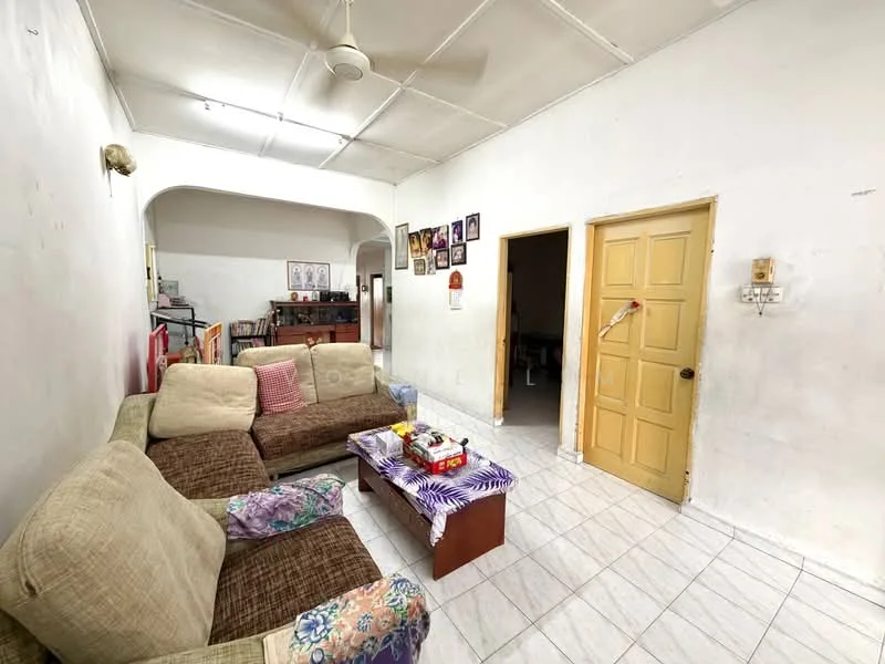 Living features: 3-seater fabric sofa in beige, 2-seater fabric sofa with floral pattern, wooden coffee table, white tiled flooring, white painted walls, ceiling fan, decorative wall art, door with yellow paint, arched doorway, wall-mounted electrical outlets, light fixture on ceiling; style: traditional.