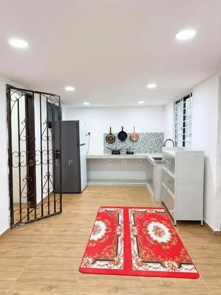 Kitchen features: white painted walls, wood-look tile flooring, recessed downlights, stainless-steel fridge, single-bowl stainless-steel sink, chrome pull-down faucet, grey patterned backsplash, white cabinetry, kitchen countertop, decorative red area rug; style: modern.