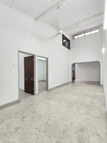 Room features: white painted walls, concrete flooring, ceiling fan, large windows, doorway leading to another room, arched doorway, high ceiling, natural light; style: minimalist.