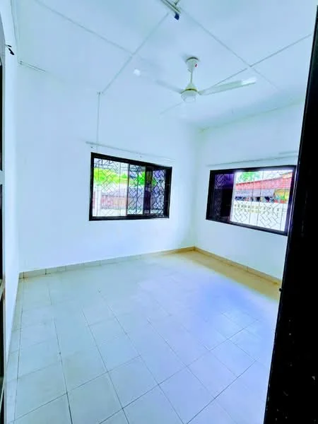 Room features: white painted walls, ceiling fan, tile flooring, two windows with security grills, natural light from windows, plain ceiling, no visible furniture, neutral color scheme; style: minimalist; view: garden.