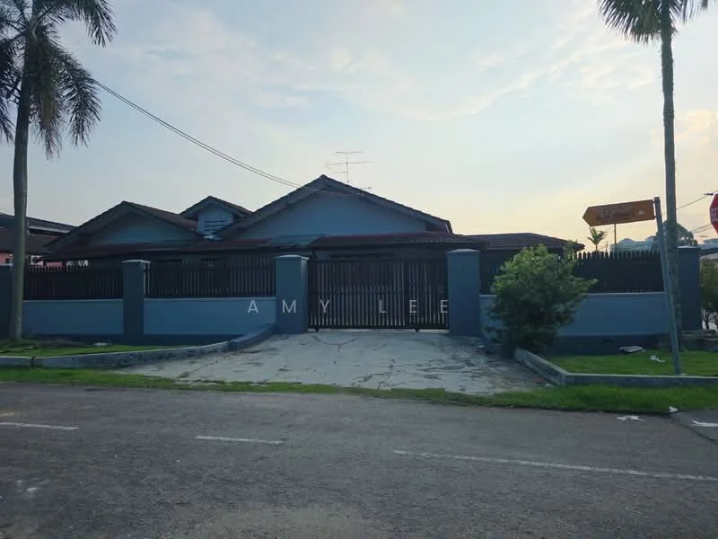 Exterior type: detached bungalow; features: grey painted facade, pitched tile roof, manicured lawn, palm trees, stone-paved driveway, fence with vertical bars, single-storey, front porch, street view, surrounded by greenery; style: modern.