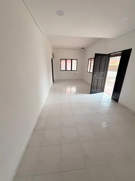 Room features: white painted walls, glossy white tile flooring, 1 ceiling light, 1 wall-mounted split AC, 2 windows, 1 black door, open doorway, neutral decor; style: modern.