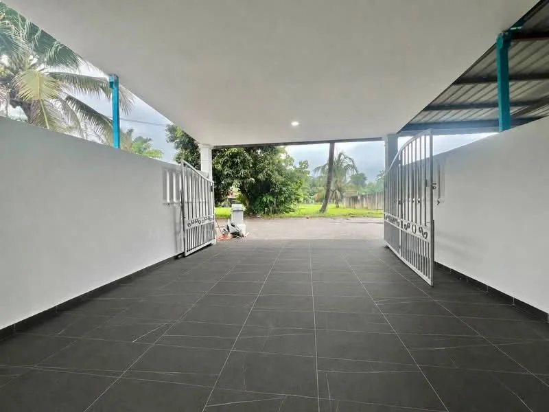Exterior type: car porch; features: open-air car porch, grey tiled flooring, white painted walls, metal gate, surrounded by greenery, overhead roof structure, natural light from overhead, paved driveway; style: modern.