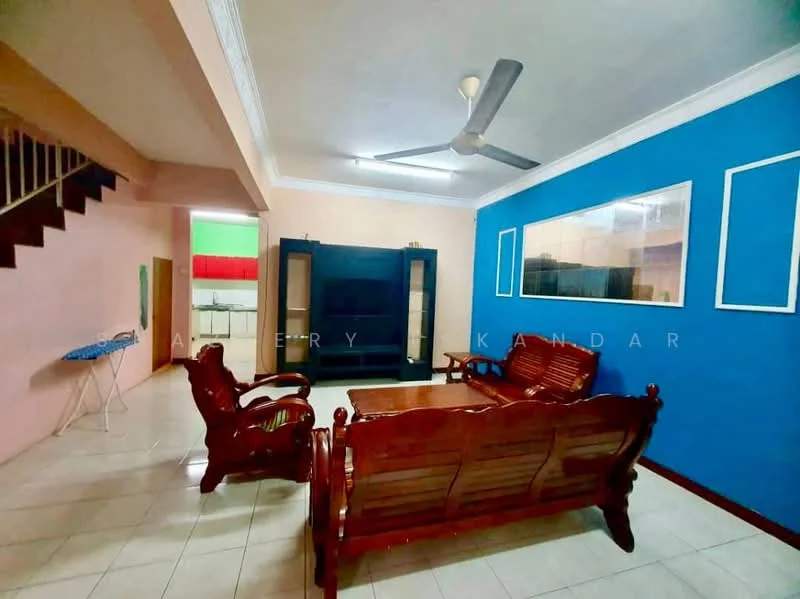Living features: cream painted walls, blue accent wall, white ceiling, 5-blade ceiling fan, tile flooring, wooden sofa set, wooden coffee table, wall-mounted TV unit, decorative wall frames, staircase visible in background; style: modern.