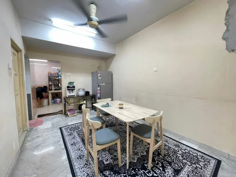 Dining features: light grey walls, marble flooring, 5-blade ceiling fan, dining table with light wood finish, 3 upholstered dining chairs in light grey, black and white patterned area rug, refrigerator, open doorway leading to kitchen, wall-mounted light fixture; style: minimalist.
