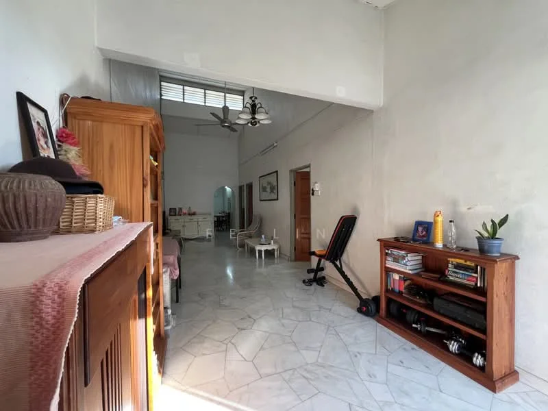 Room features: white painted walls, marble flooring, high ceiling, ceiling fan with light, wooden storage cabinet, wooden bookshelf, exercise equipment, decorative plant, natural light from windows, open layout; style: modern.