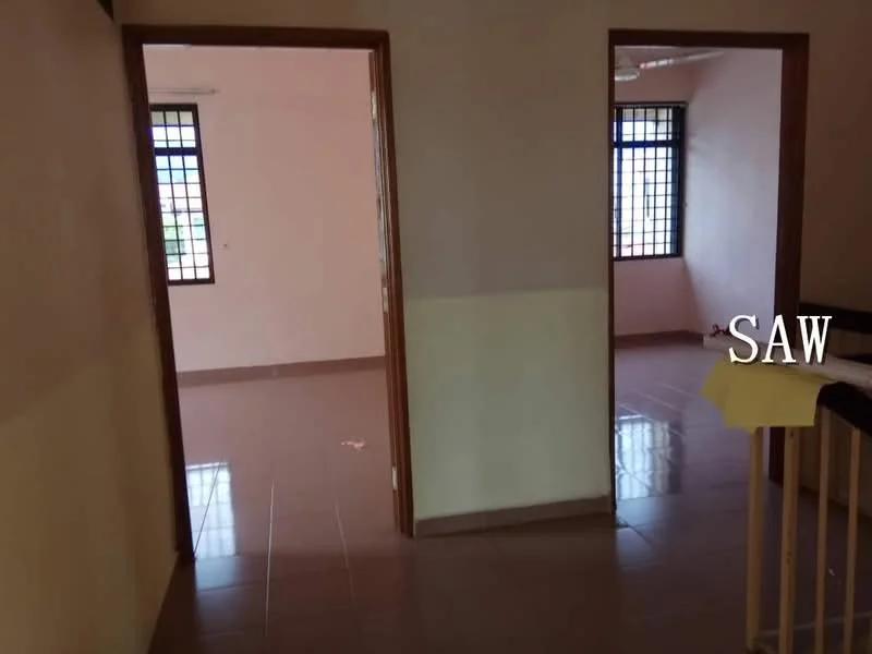 Room features: light beige painted walls, brown wooden door frames, brown tiled flooring, two windows with grid pattern, ceiling fan, corner railing, yellow paper on railing.