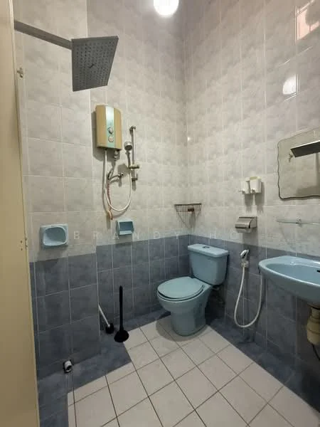 Bathroom features: blue tiled walls, white tiled flooring, one-piece toilet, sink with pedestal, wall-mounted mirror, shower head with adjustable height, handheld shower, shower curtain rod, soap dish, toilet paper holder, water heater, wall-mounted storage shelf.