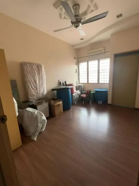 Room features: laminate flooring, cream painted walls, ceiling fan, window with blinds, air conditioning unit, various storage boxes, furniture covered in plastic, door leading to another room.