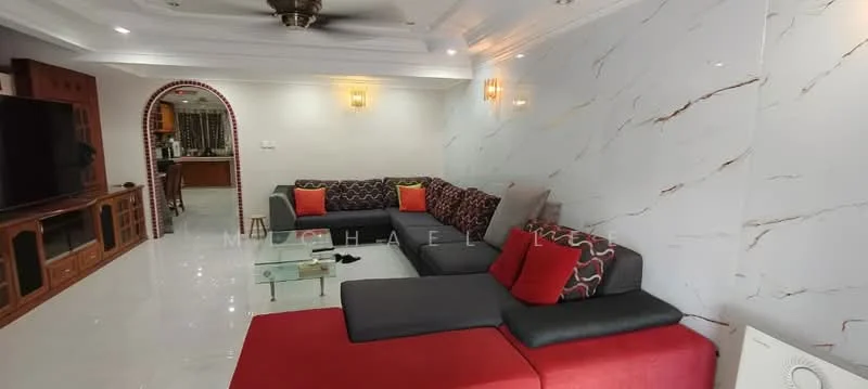 Living features: L-shape sectional sofa in grey and red, glass coffee table, white marble flooring, white painted walls with crown moulding, ceiling fan with light, wall-mounted TV, wooden TV console, decorative cushions, recessed lighting, arched doorway to kitchen, decorative wall art; style: modern.