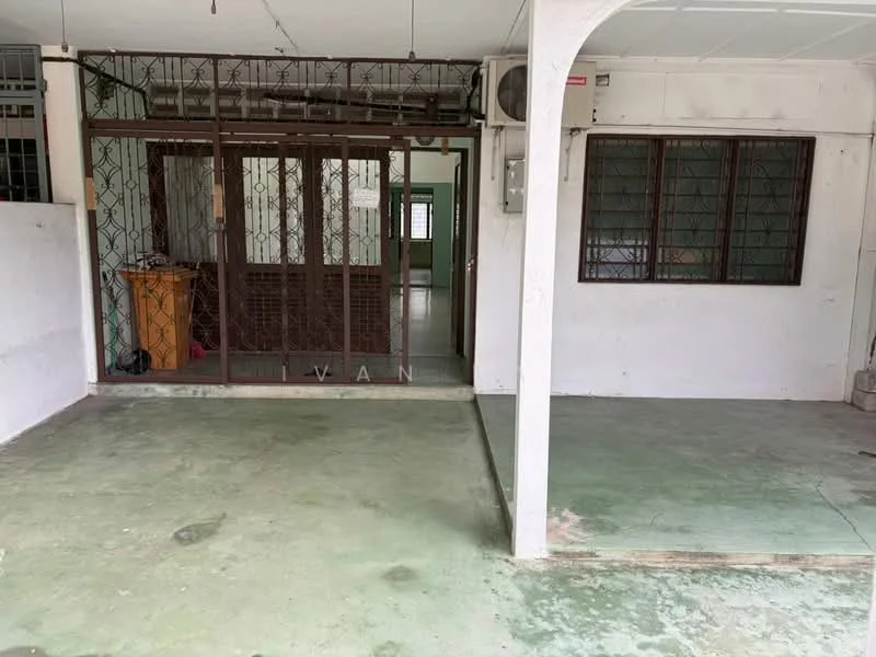 Room features: green concrete flooring, white painted walls, metal security grille, window with metal bars, exposed ceiling, air conditioning unit, open layout, partition wall, doorway leading to another room; style: minimalist.