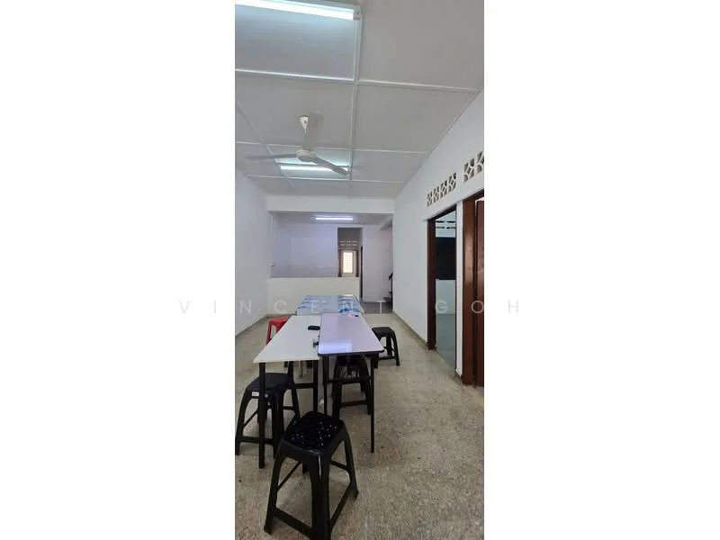 Room features: ceiling with fluorescent lights, wall-mounted ceiling fan, light-colored walls, terrazzo flooring, dining table with multiple chairs, open layout, doorway leading to another room, window with natural light; style: minimalist.