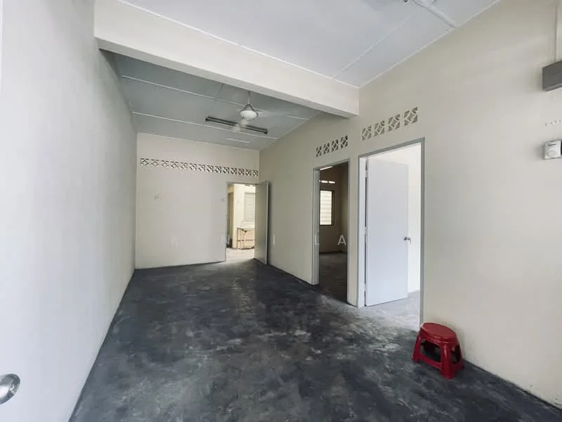Room features: white painted walls, concrete flooring, ceiling fan, sliding door, window with grille, doorway leading to another room, doorway leading to bathroom, light fixture on ceiling; style: minimalist.