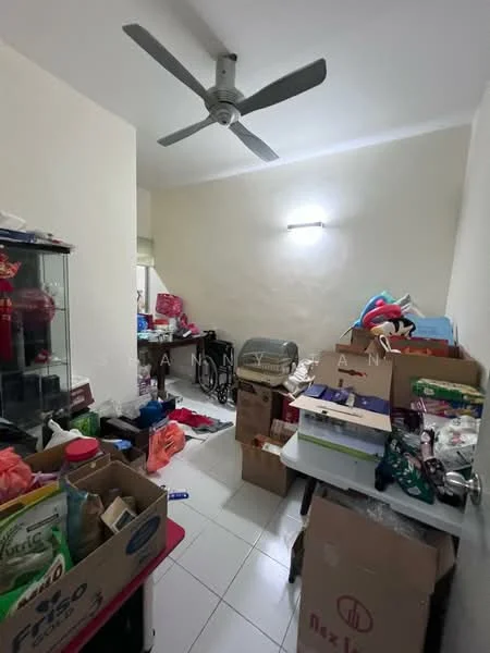 Room features: white painted walls, white tiled flooring, ceiling fan, various cardboard boxes, plastic storage containers, miscellaneous items scattered, table with items on it, light fixture on ceiling.