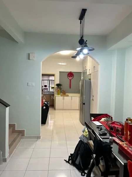 Room features: light grey painted walls, white tiled flooring, arched doorway, recessed ceiling lights, stainless-steel refrigerator, kitchen cabinetry, dining table with chairs, decorative items on table, staircase leading to upper floor, window with sheer curtains; style: modern.