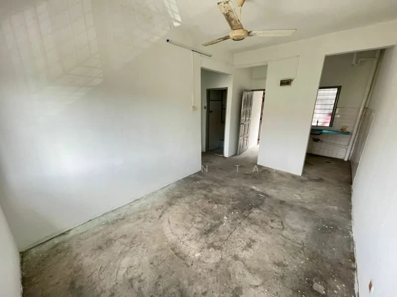 Room features: white painted walls, concrete flooring, ceiling fan, window with grid, doorway leading to another room, doorway leading to kitchen area; style: minimalist.
