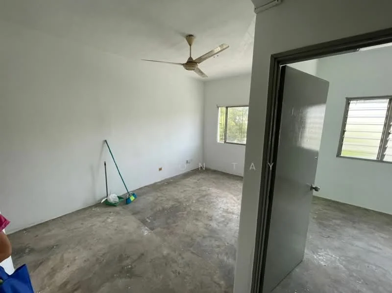 Room features: white painted walls, concrete flooring, 5-blade ceiling fan, window with horizontal slats, door with handle, cleaning supplies visible, natural light from window; style: minimalist; view: garden.