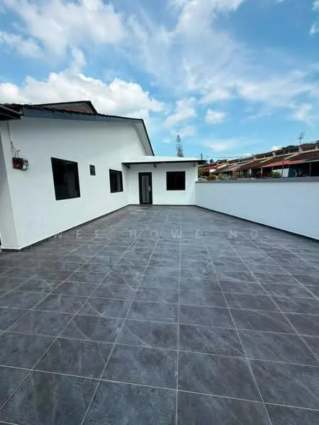Exterior features: flat roof, white painted facade, grey tiled flooring, open terrace, surrounded by low-rise buildings, clear blue sky, no visible landscaping; style: modern.