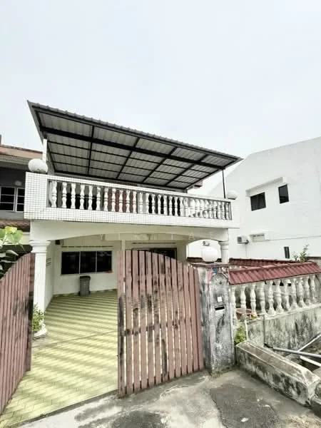 Exterior type: semi-detached house; features: covered porch with metal roof, white painted facade, balustrade on balcony, green tiled flooring, wooden gate, exposed brick wall, air conditioning units visible, front yard with landscaping, driveway, two-storey structure; style: modern.