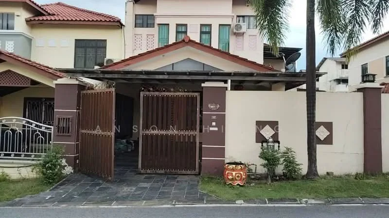 Exterior type: linked terrace house; features: gated entrance, brown wooden gates, stone-paved walkway, manicured lawn, palm trees, red tiled roof, cream painted facade, decorative wall panels, outdoor lighting, front porch area; style: modern.