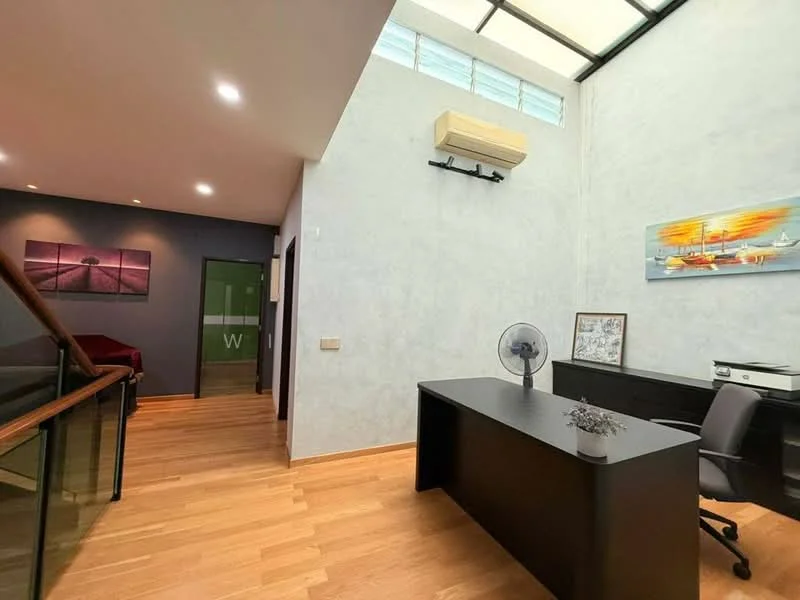 Study features: light grey painted walls, wooden flooring, ceiling-mounted air conditioning unit, black desk, black office chair, table fan, framed artwork on wall, large window with natural light, open space layout; style: modern. Hallway features: dark grey painted walls, wooden flooring, framed artwork on wall; style: modern.
