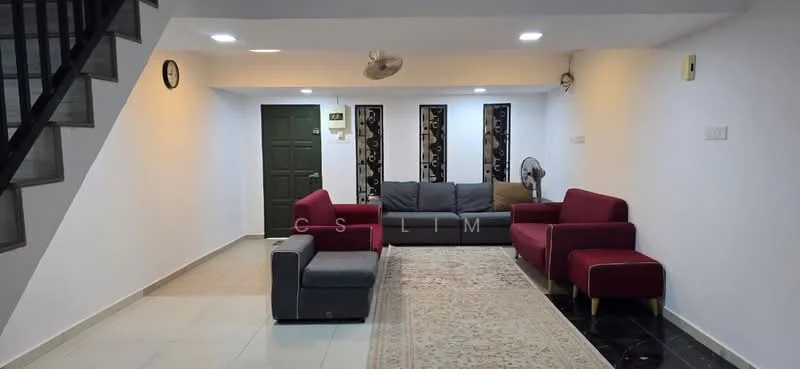 Living features: white painted walls, marble tile flooring, 5-blade ceiling fan with light, sofa in grey fabric, 2 red armchairs, area rug with geometric pattern, wall-mounted clock, decorative wall panels, green door, staircase with black railing; style: modern.