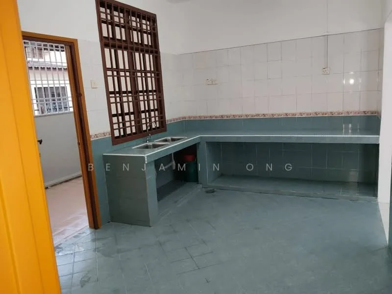 Kitchen features: green tiled countertop, single-bowl stainless-steel sink, wall-mounted faucet, white tiled walls, grey tiled flooring, built-in cabinetry, window with security bars, open layout.