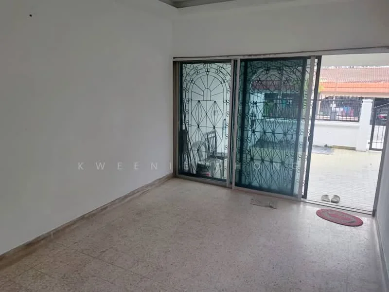 Room features: white painted walls, tile flooring, sliding glass door, security grille, natural light from outside, door mat, corner of the room visible, no visible furniture.