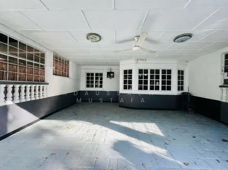 Room features: white painted walls, black accent wall, slate tile flooring, ceiling fan, multiple windows, glass-paneled windows, decorative railing, recessed lighting; style: modern.