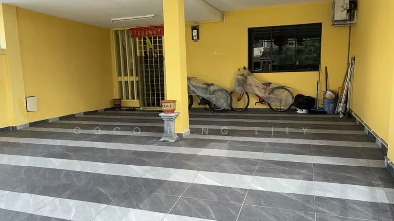 Exterior features: yellow painted walls, grey and white striped flooring, covered parking area, bicycle covered with tarp, storage items visible, wall-mounted air conditioning unit, security grille at entrance; style: modern.