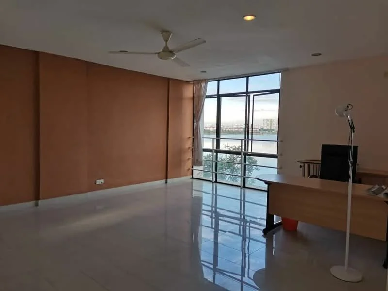 Room features: cream painted walls, marble tile flooring, 5-blade ceiling fan, floor-to-ceiling windows, curtains, office desk, task lamp, view of water; style: modern; view: water.