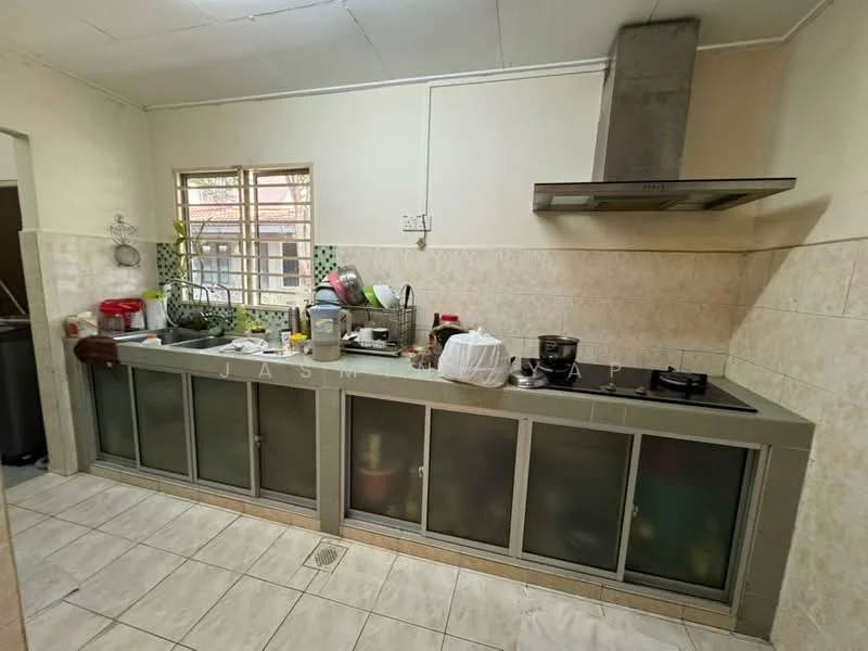 Kitchen features: L-shaped kitchen layout, grey tiled backsplash, stainless-steel range hood, built-in gas hob, double-bowl stainless-steel sink, wooden cabinetry with glass panels, white tiled flooring, window with grid pattern, various kitchen appliances visible, countertop with cluttered items; style: modern.