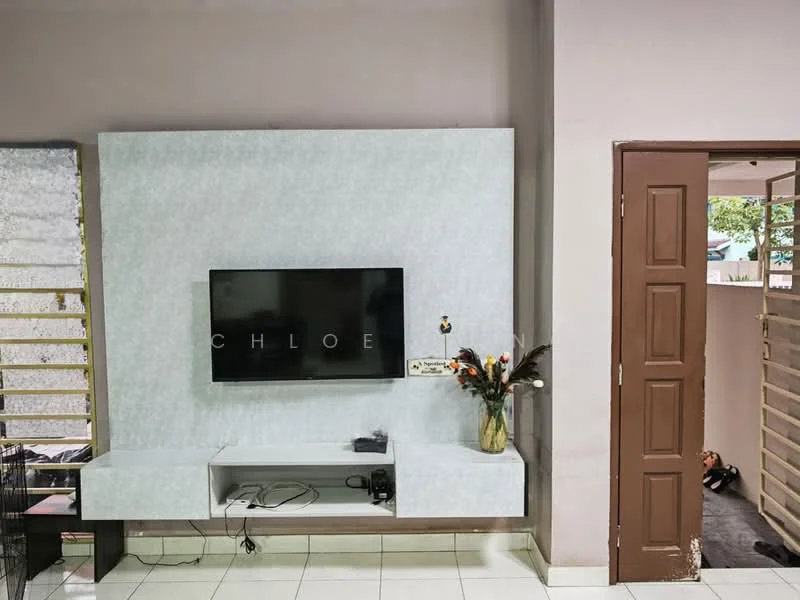 Living features: light grey accent wall, white wall-mounted TV unit, flat-screen TV, decorative vase with flowers, white tiled flooring, recessed lighting, brown wooden door, open space leading to another room; style: modern.