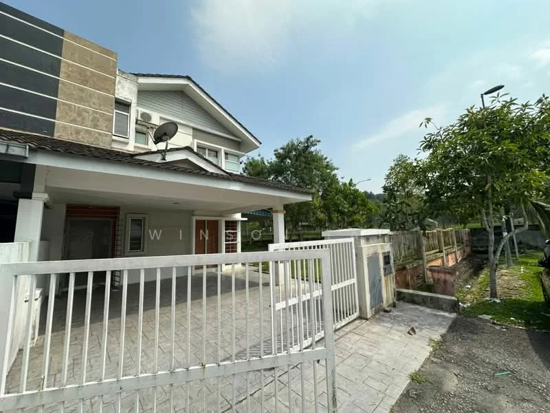 Exterior type: semi-detached house; features: white painted facade, grey accent wall, pitched tile roof, front porch with railing, manicured lawn, paved driveway, satellite dish, fenced perimeter, garden area with trees, side walkway; style: modern.