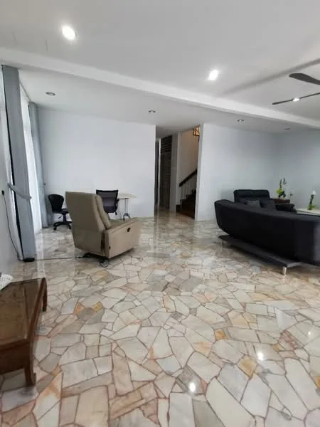 Living features: cream painted walls, polished stone flooring, 5-blade ceiling fan with light, large windows with sheer curtains, sofa in dark color, coffee table, office chair, desk, staircase visible in background; style: modern.