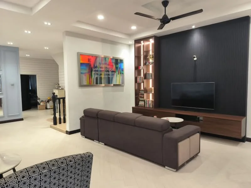 Living features: 3-seater fabric sofa in grey, coffee table, wall-mounted TV, wooden TV console, decorative wall with bookshelves, ceiling fan with light, recessed downlights, accent wall with vertical panels, artwork on wall, light-colored flooring, open layout to adjacent room; style: modern.