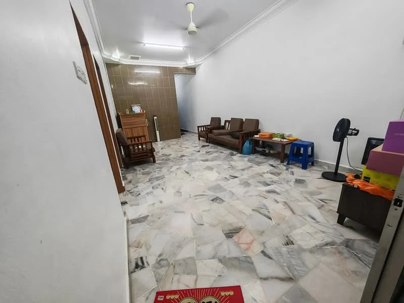 Living features: marble flooring, white painted walls, ceiling fan, 2-seater fabric sofa in brown, 2 armchairs in brown, wooden coffee table, blue plastic stool, decorative wall clock, floor fan.