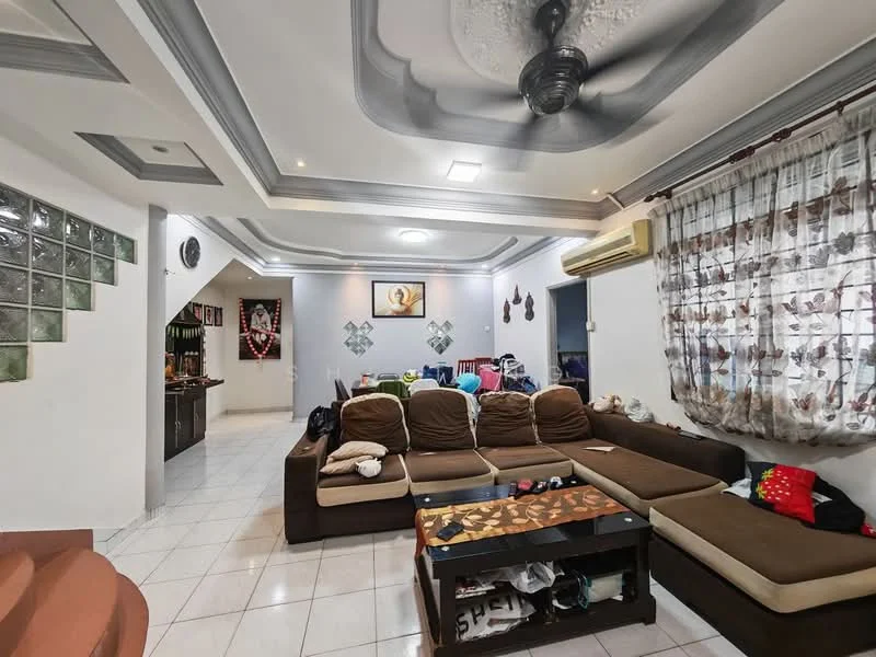 Living features: L-shape sectional sofa in brown, coffee table with decorative top, white walls with crown moulding, tray ceiling with ceiling fan, recessed downlights, large window with sheer curtains, tile flooring, air conditioning unit on wall, decorative wall art, open layout to adjacent kitchen, staircase visible in background; style: modern.
