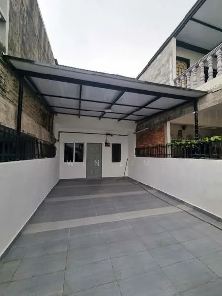 Exterior features: covered car porch, grey tiled flooring, white painted walls, metal roof, fenced perimeter, single main entrance door, windows with black grills, exposed brick wall, concrete wall, paved walkway; style: modern.
