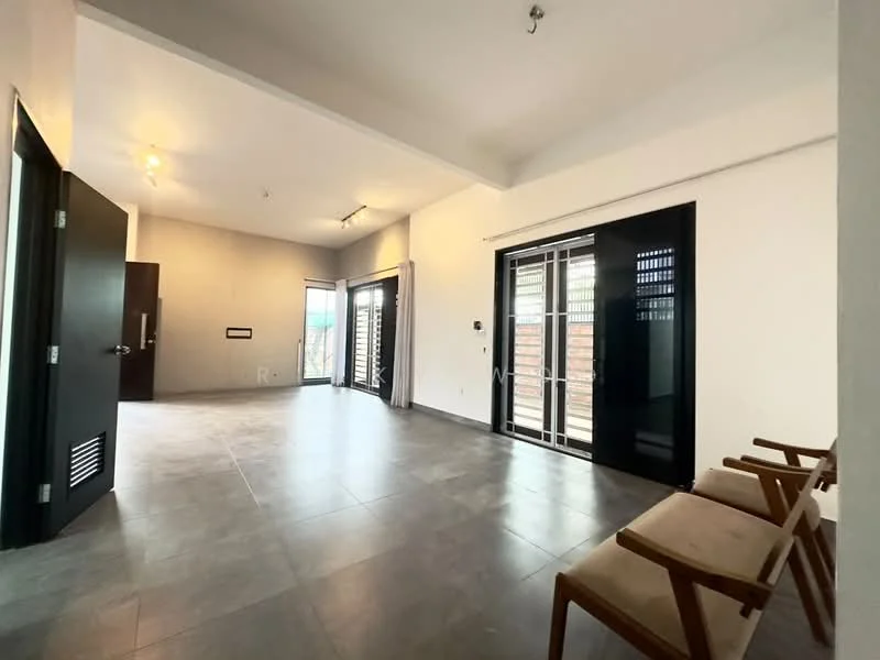 Living features: grey tile flooring, white painted walls, exposed ceiling with recessed lighting, sliding glass doors, black framed windows, curtains, two wooden chairs, wall-mounted intercom, air conditioning unit, open layout; style: modern.