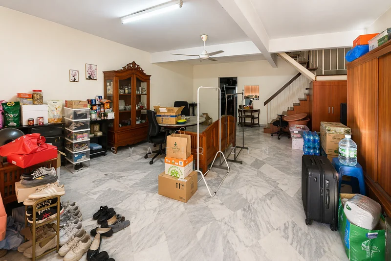 Room features: marble flooring, white painted walls, ceiling fan, wooden staircase, wooden cabinets, glass display cabinet, plastic storage boxes, cardboard boxes, various household items, office chair, folding rack, shoes on the floor.