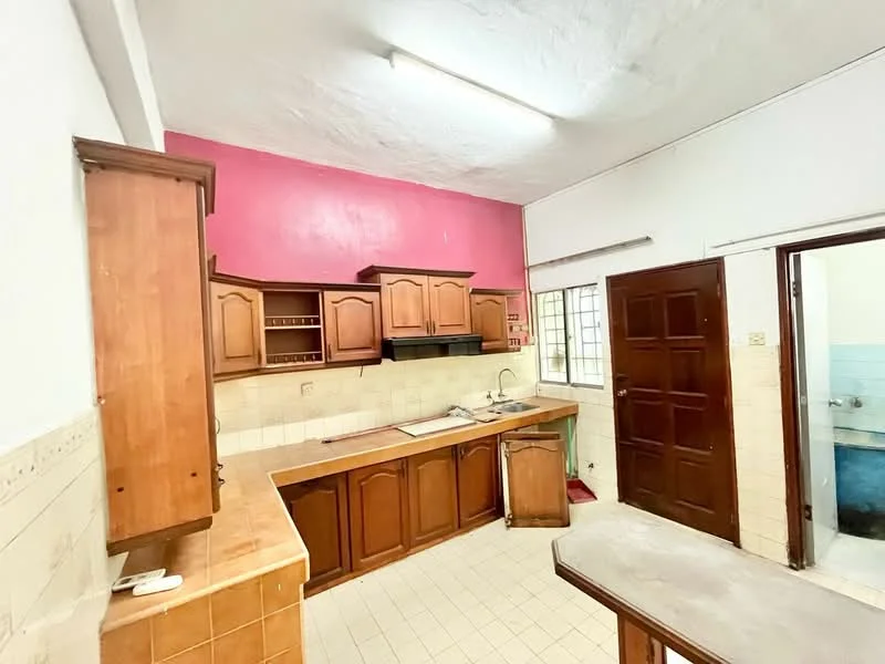 Kitchen features: wood cabinetry, pink painted accent wall, white tiled walls, ceramic tile flooring, single-bowl stainless-steel sink, black range hood, countertop with tile finish, window above sink, kitchen island, built-in shelving, doorway to adjacent room; style: traditional.