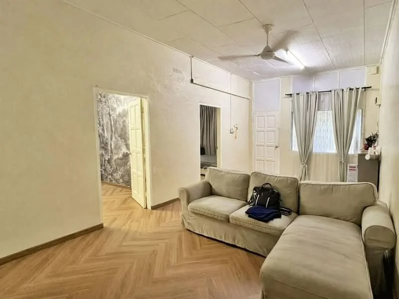 Living features: light beige fabric sofa, wooden flooring with herringbone pattern, white painted walls, ceiling fan, curtains in light grey, doorway leading to another room, doorway with white panel doors, decorative wall with patterned wallpaper; style: minimalist.