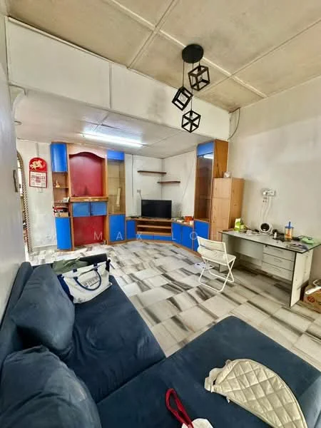 Living features: blue cabinetry, wooden TV console, wall-mounted TV, sofa in dark blue fabric, ceiling light fixture with geometric design, laminate flooring with tile pattern, white walls, open shelving, desk with chair, decorative items on desk, window with natural light; style: modern.
