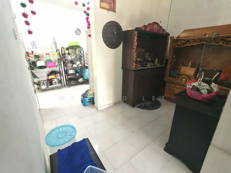 Room features: white painted walls, ceramic tile flooring, wooden cabinet, decorative wall shelf, floor mat, plastic storage containers, decorative items on shelf, blue fabric, open shelving unit with kitchenware.