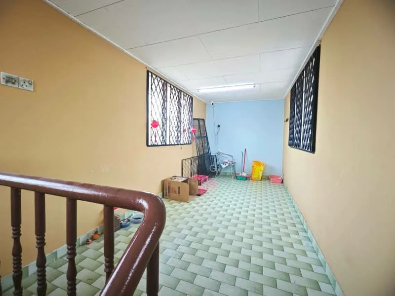 Room features: green and white patterned tile flooring, cream painted walls, blue painted wall, metal security grilles on windows, ceiling with recessed lighting, wooden handrail, boxes and miscellaneous items on the floor.