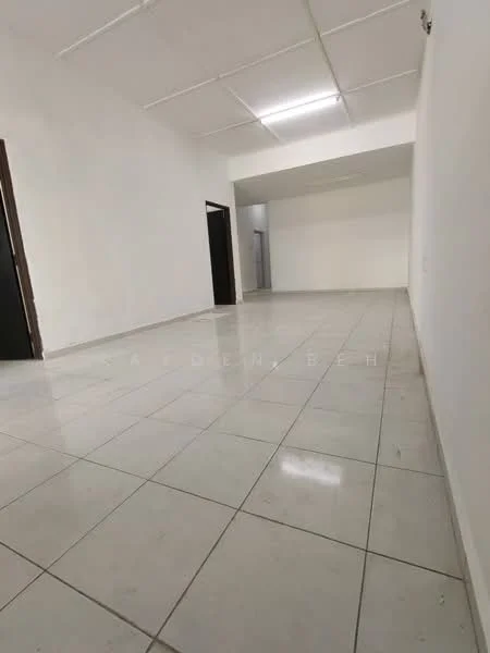Room features: white painted walls, white ceiling, tile flooring, recessed lighting, open layout, no visible furniture, two doorways, large empty space.