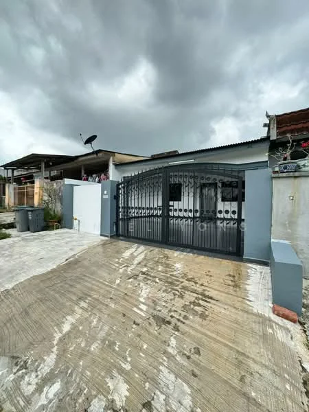 Exterior type: detached bungalow; features: black wrought iron gate, concrete driveway, grey painted walls, roof with overhang, satellite dish on roof, manicured landscaping, visible outdoor area, paved walkway; style: modern.